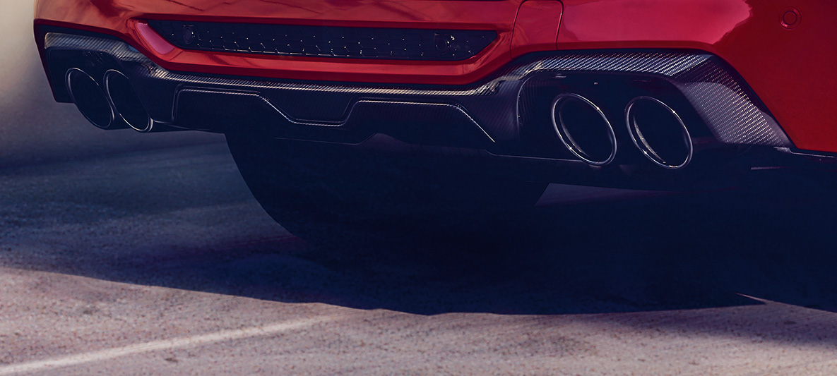 BMW X4 M Competition, πίσω διαχύτης από ανθρακονήματα. BMW X4 M Competition σε κόκκινο Toronto μεταλλικό, εξωτερικό, πακέτο εξωτερικού εξοπλισμού M Carbon, πίσω διαχύτης από ανθρακονήματα.