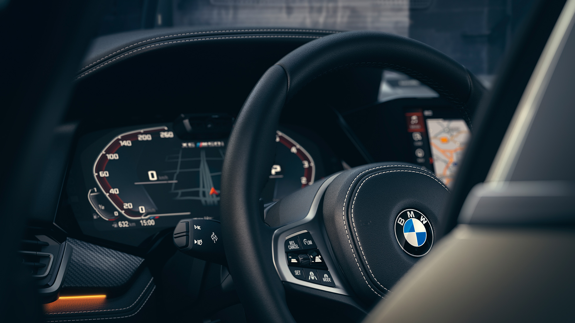 Συστήματα υποστήριξης BMW. Κοντινή λήψη του εσωτερικού της BMW με εστίαση στον πίνακα οργάνων.
